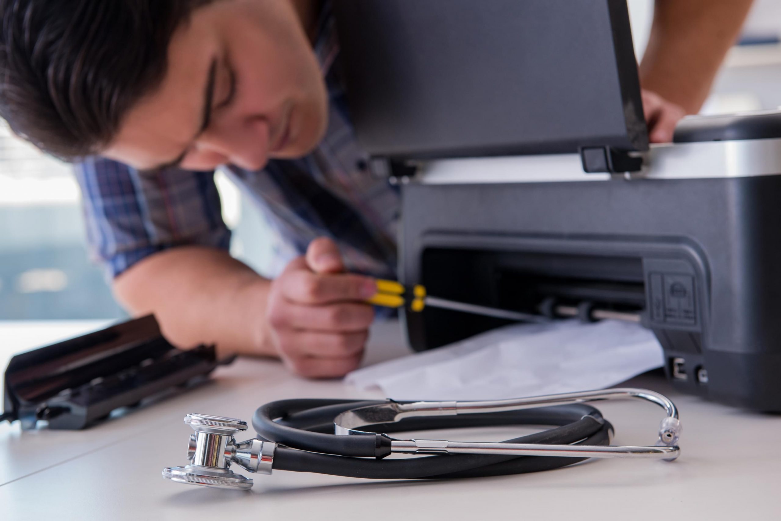 Printer Doctor technician servicing a printer